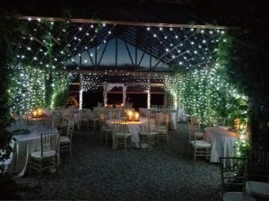 vine chapel at night with wedding tables all around