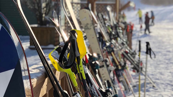 Skis laid against a rack at Asessippi Ski Resort.