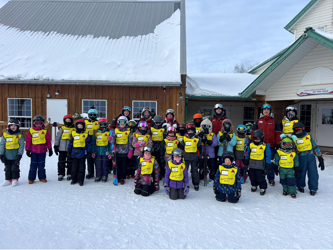 A group of ACES members standing in the snow at Asessippi
