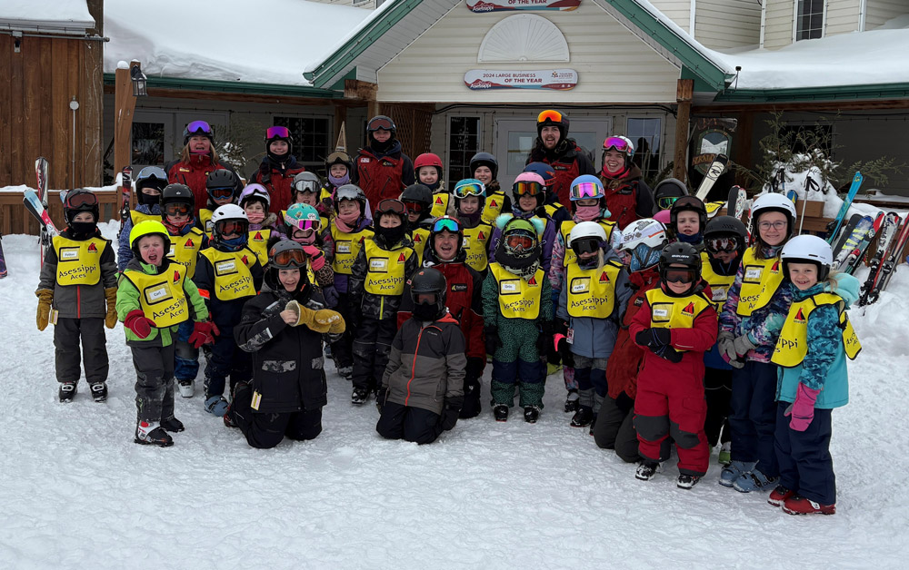 A group of ACES members standing in the snow at Asessippi