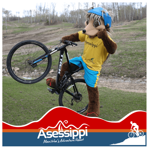 Ollie mascot posing with a bike